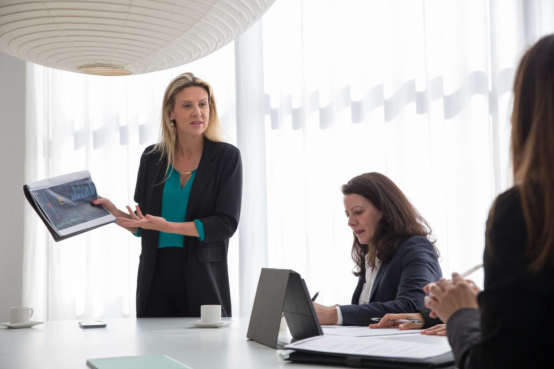 A UAE business owner reviewing figures with a colleague