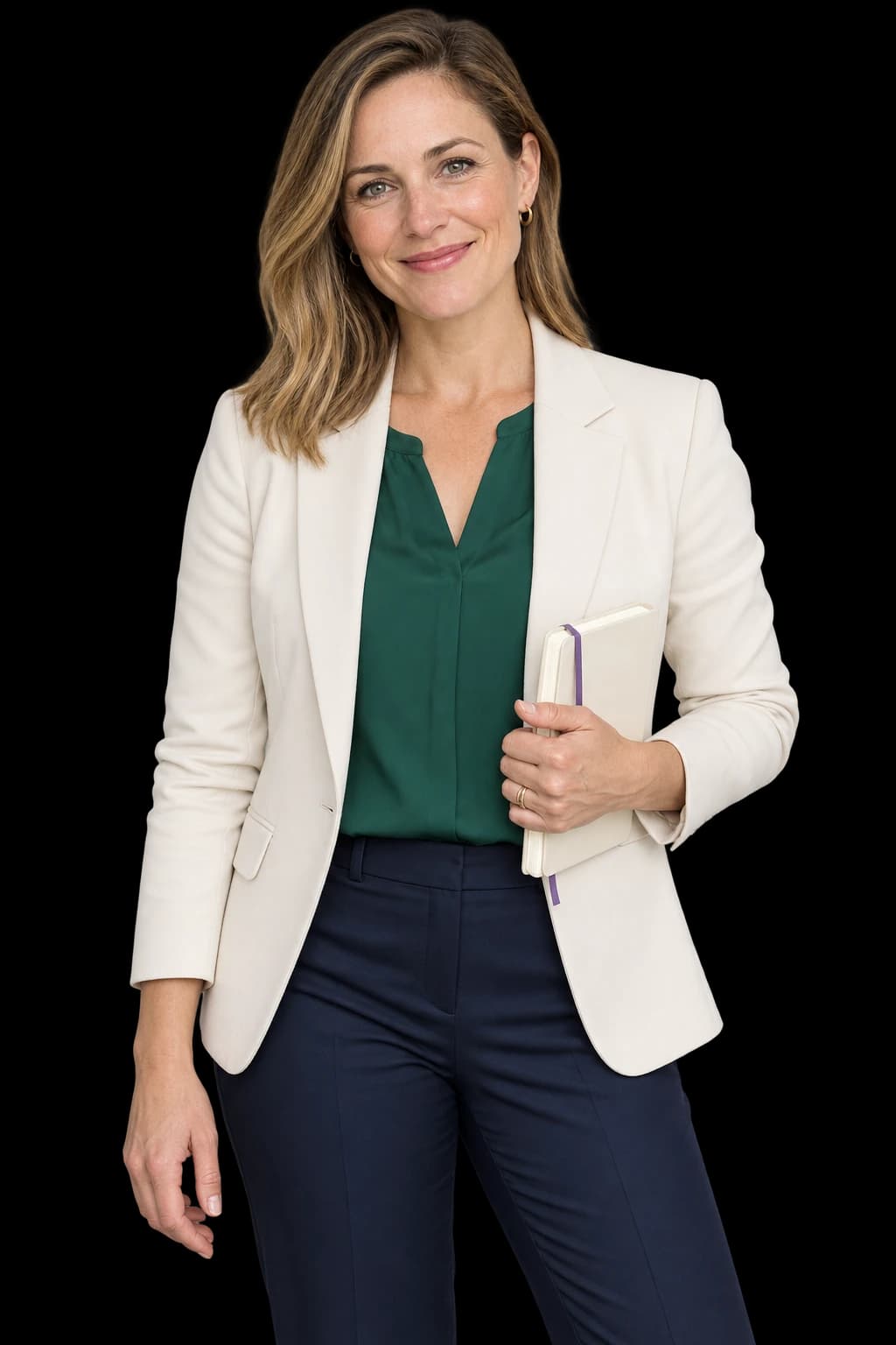 A welcoming woman with dark blonde hair in an ivory blazer and emerald blouse holding a cream notebook.
