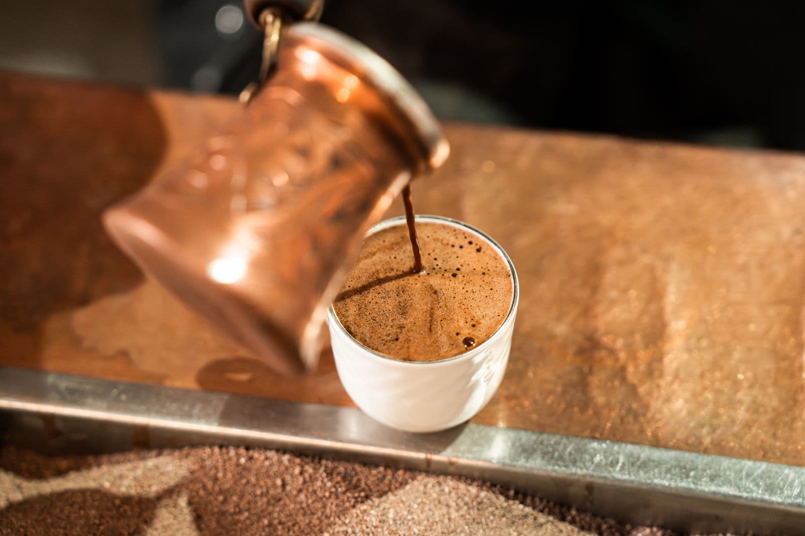 A traditional dallah coffee pot and cups